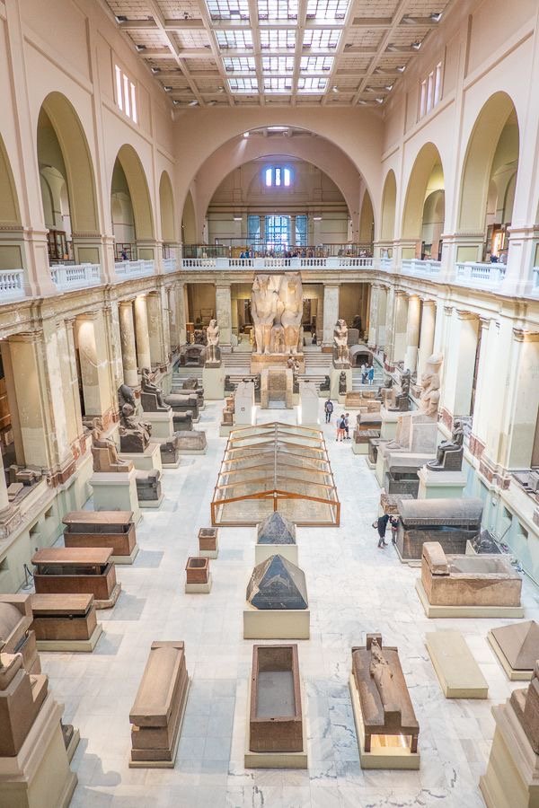 Egyptologist presenting King Tutankhamun’s treasures to visitors inside Cairo’s Grand Egyptian..