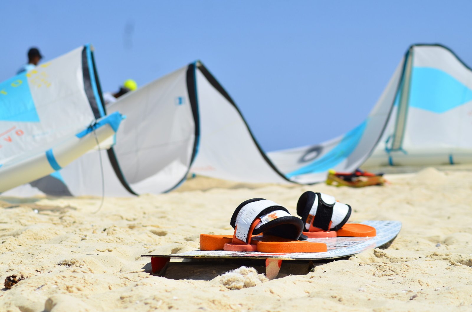 High-quality kite and board gear arranged on the golden beach of Hurghada before the start of a kite surfing lesson.