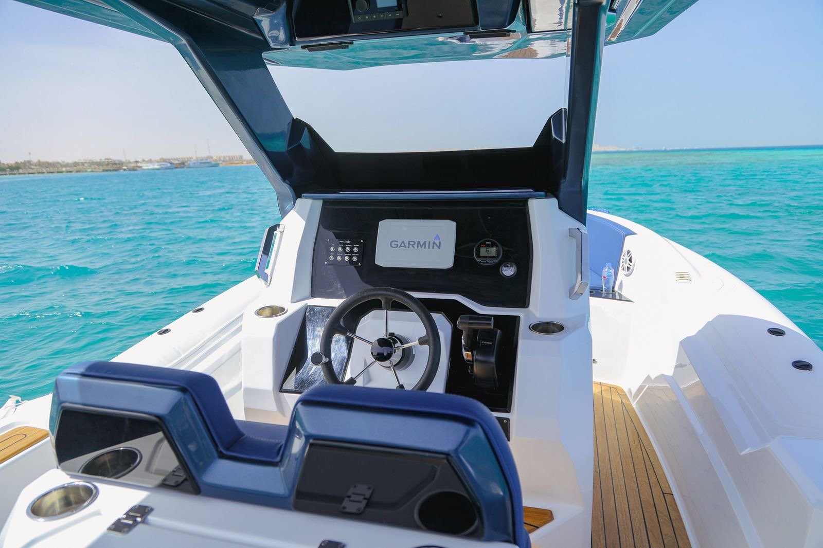 Tourists relaxing under the sun on Bayoud Island during a private Red Sea speed boat excursion from Hurghada.
