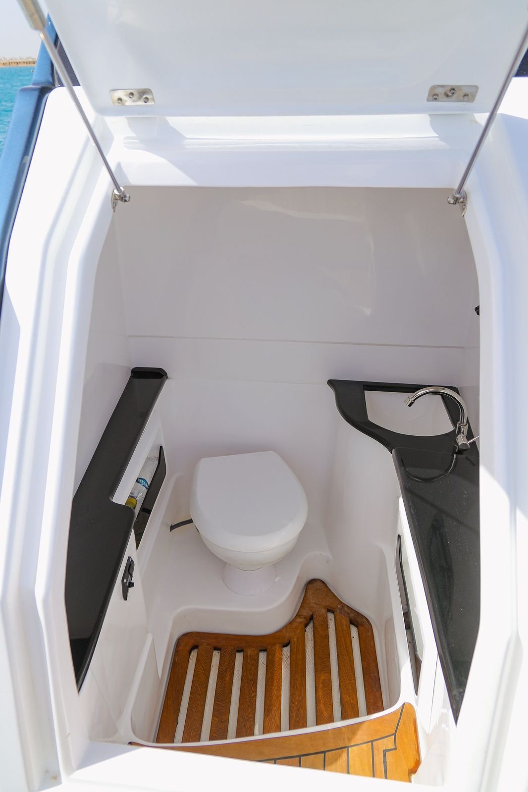 Tourists relaxing under the sun on Bayoud Island during a private Red Sea speed boat excursion from Hurghada.