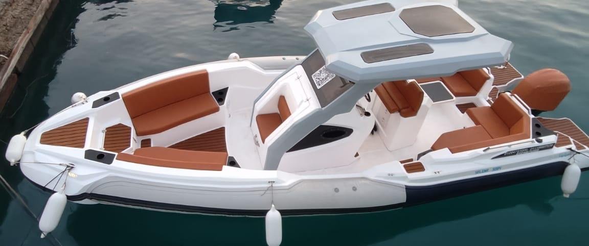 Tourists relaxing under the sun on Bayoud Island during a private Red Sea speed boat excursion from Hurghada...