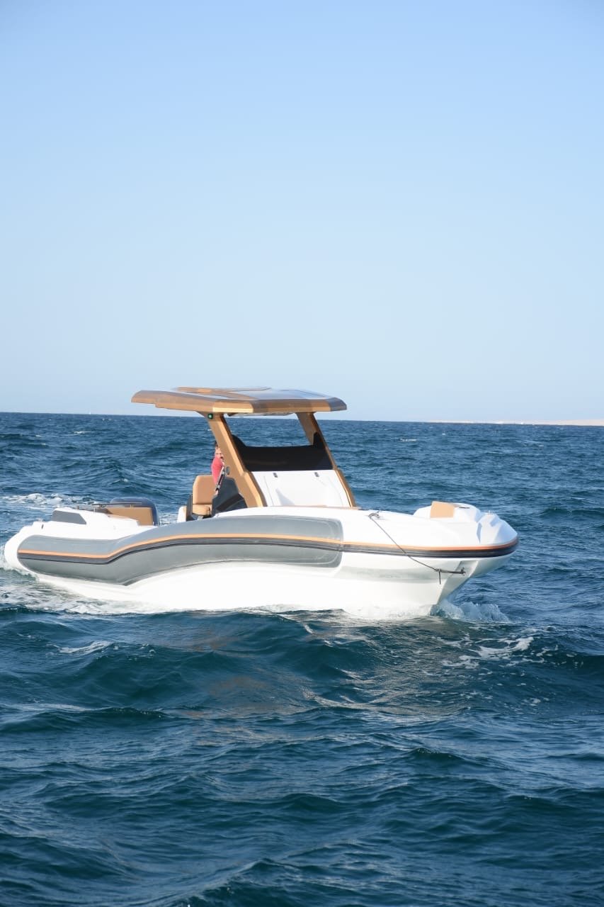 Tourists relaxing under the sun on Bayoud Island during a private Red Sea speed boat excursion from Hurghada.