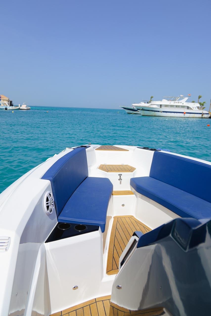 Tourists relaxing under the sun on Bayoud Island during a private Red Sea speed boat excursion from Hurghada.