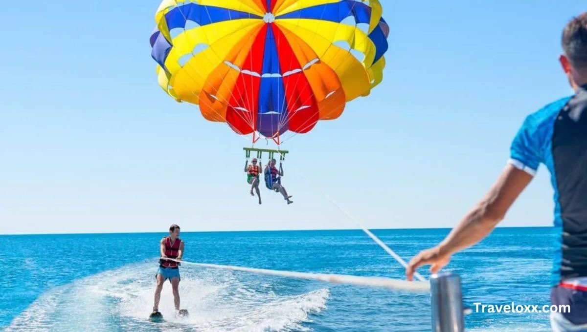 Aerial view of reefs and turquoise waters during parasailing.