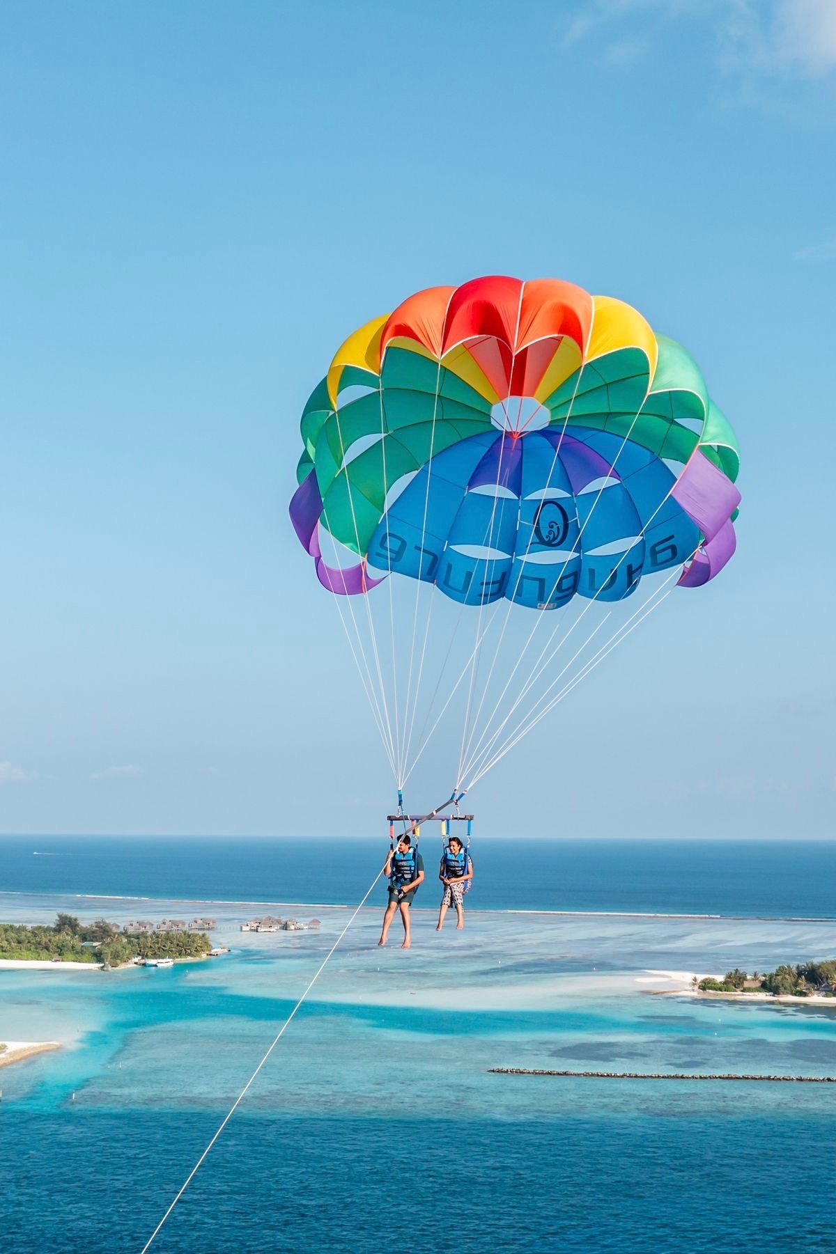Solo parasailing takeoff — panoramic Hurghada coastline views.;