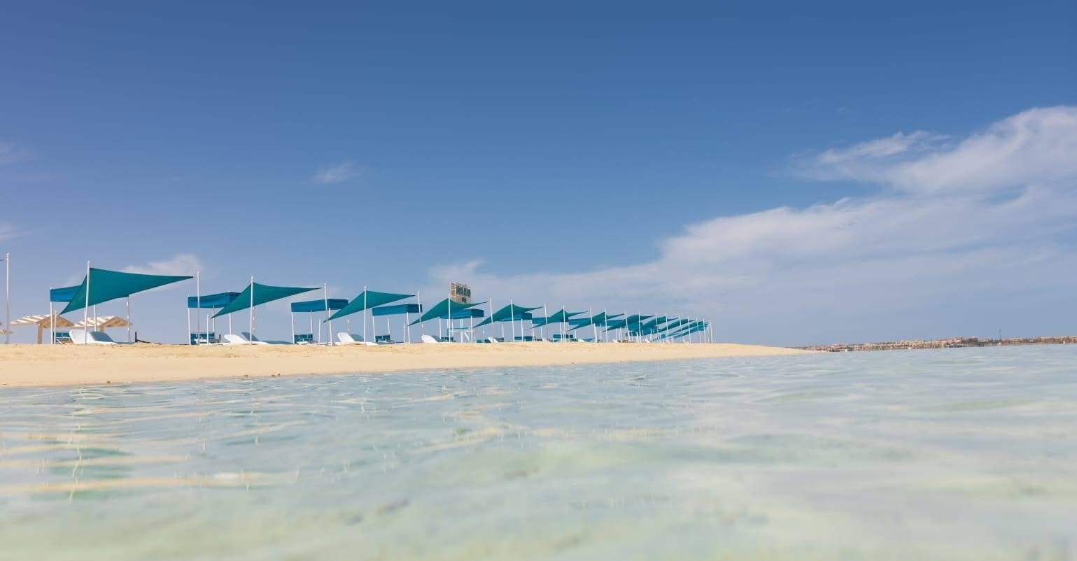 Guided snorkeling over colorful coral gardens at Biance Island Utopia Safaga....