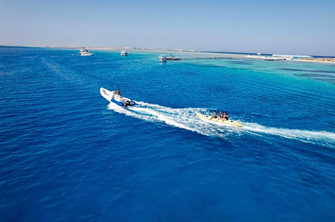 Guided snorkeling over colorful coral gardens at Biance Island Utopia Safaga....
