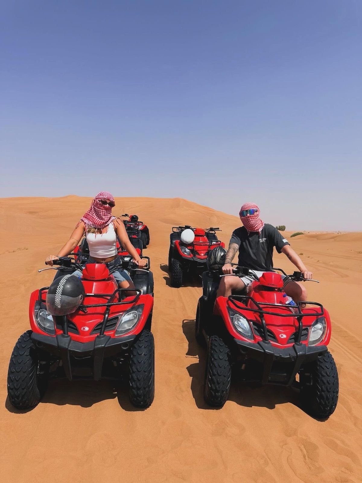 Chase the sun across golden dunes on the Desert Quad Safari Hurghada Sunset.--