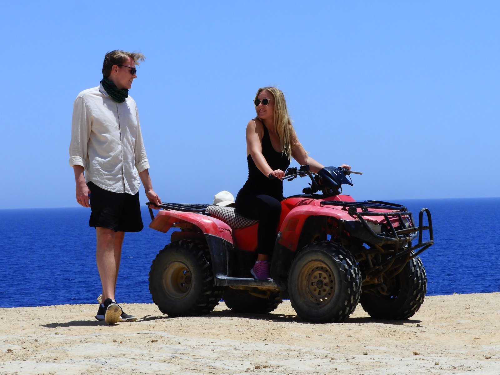 Chase the sun across golden dunes on the Desert Quad Safari Hurghada Sunset.-