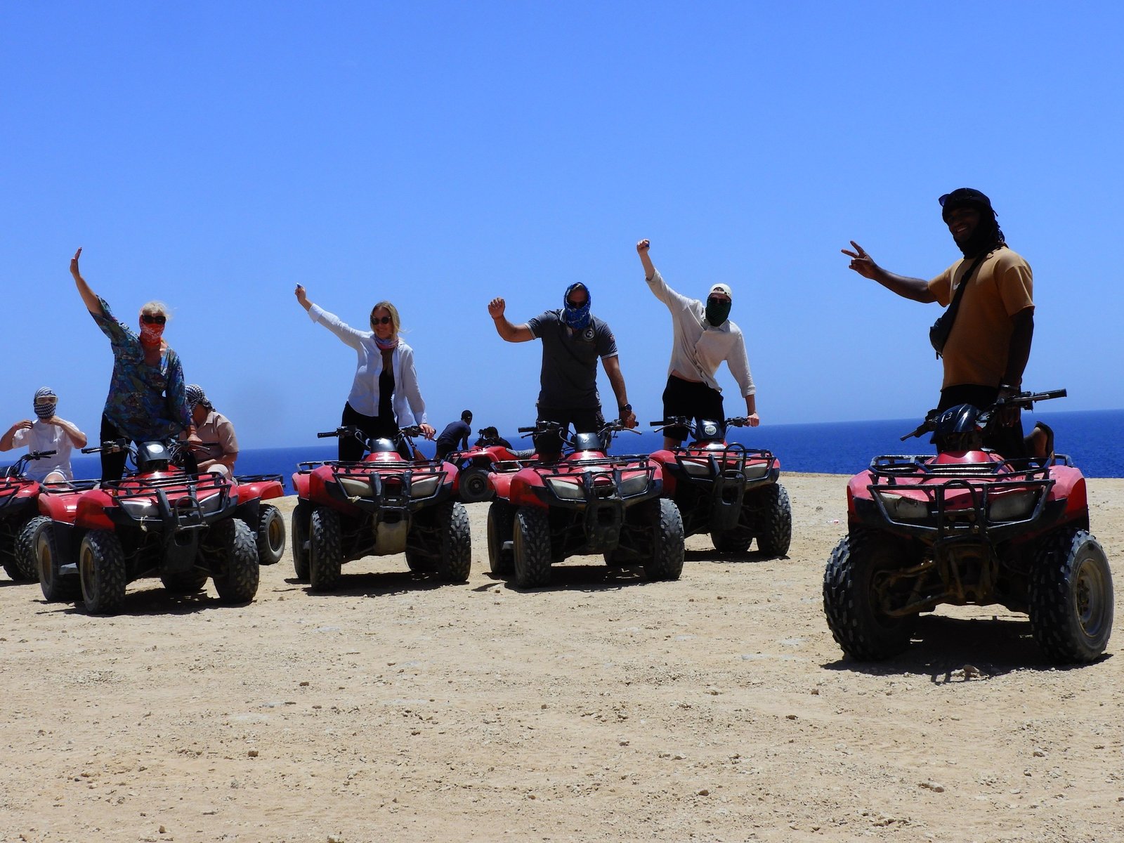 Chase the sun across golden dunes on the Desert Quad Safari Hurghada Sunset.=