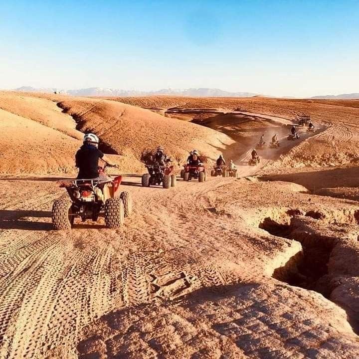 Chase the sun across golden dunes on the Desert Quad Safari Hurghada Sunset..