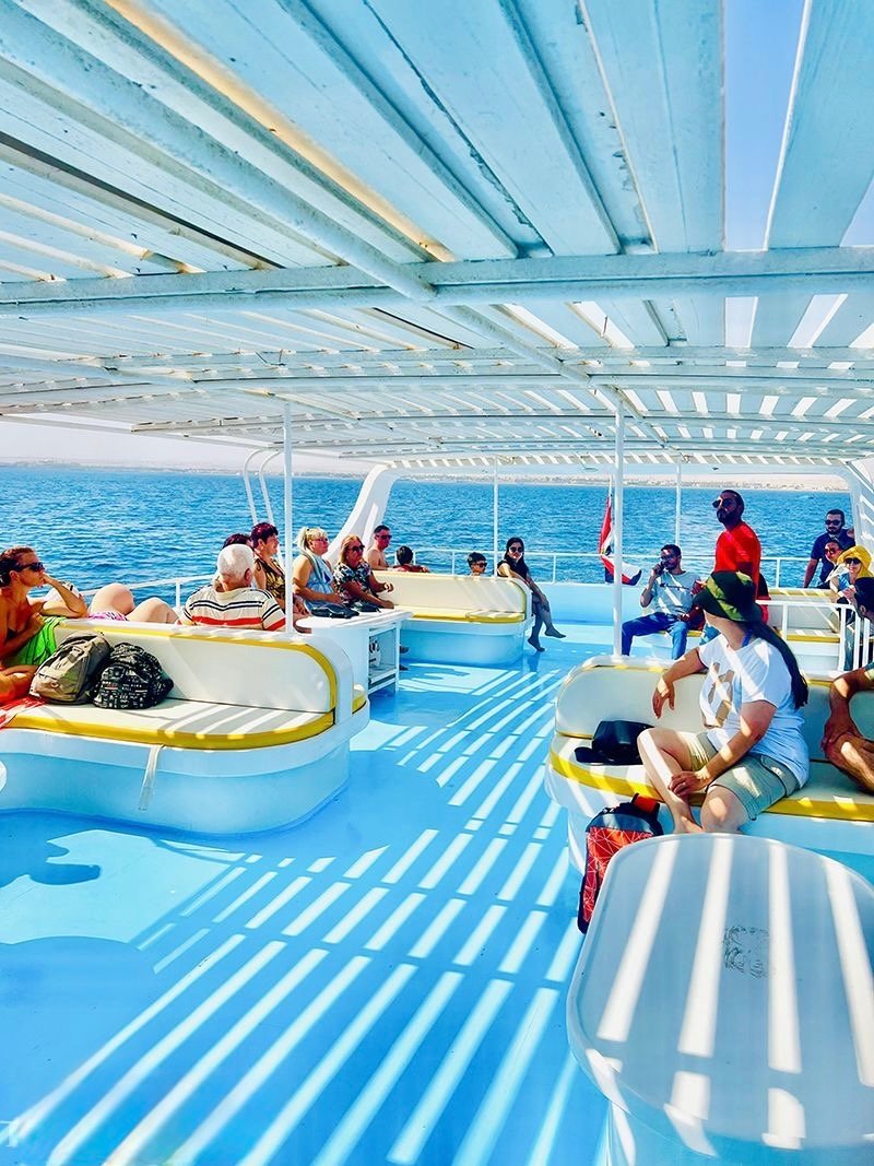Cruise to Mahmya Island Hurghada on a comfortable boat with sun and shaded areas.