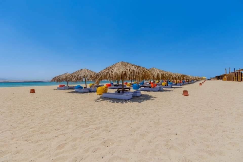 Powdery white sand and turquoise shallows on Utopia Island Safaga.///