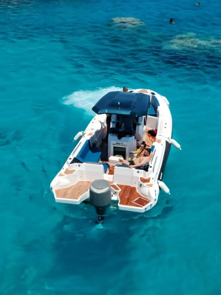  Private speedboat racing across Red Sea Hurghada blue water clear sky]