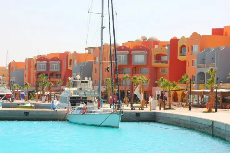Hurghada marina getting smaller as private speedboat accelerates into Red Sea