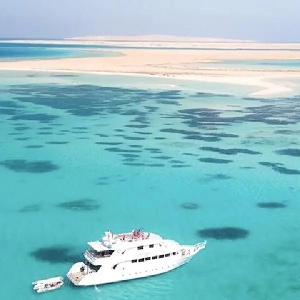 Orange Bay beach turquoise water snorkeling reef Hurghada Red Sea coral garden]