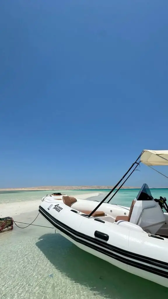Hurghada marina getting smaller as private speedboat accelerates into Red Sea
